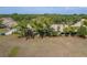 Townhome with a serene backyard view and lush greenery, offering a private outdoor space at 11241 Dollar Lake Dr # 5, Port Richey, FL 34668