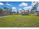 Large backyard showcasing a storage shed and lush green lawn with ample space at 11336 Flower Ave, Weeki Wachee, FL 34613