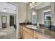 Bathroom vanity featuring a sink and a granite countertop, with views to the next room at 11336 Flower Ave, Weeki Wachee, FL 34613