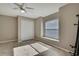Neutral bedroom with tile flooring, a window, and a closet with double doors at 11336 Flower Ave, Weeki Wachee, FL 34613