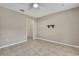 Neutral bedroom with ceiling fan, tile flooring, fresh paint, and closet at 11336 Flower Ave, Weeki Wachee, FL 34613