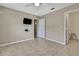 Neutral bedroom with tile flooring, ceiling fan, fresh paint, and closet at 11336 Flower Ave, Weeki Wachee, FL 34613