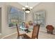 Dining nook with large windows providing lots of natural light to the area at 11336 Flower Ave, Weeki Wachee, FL 34613