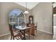 Cozy dining area featuring a classic dining set and a large window providing plenty of natural light at 11336 Flower Ave, Weeki Wachee, FL 34613