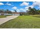 Beautiful single story home in a green, rural setting with a large front yard and a three car garage at 11336 Flower Ave, Weeki Wachee, FL 34613