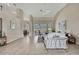 Bright living room featuring high ceilings, tile flooring, and sliding glass doors to the outdoor area at 11336 Flower Ave, Weeki Wachee, FL 34613