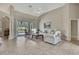 Inviting living room with tile flooring, a vaulted ceiling, and direct access to the pool area through sliding doors at 11336 Flower Ave, Weeki Wachee, FL 34613