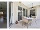 Comfortable outdoor patio area with ceiling fan and dining area at 11336 Flower Ave, Weeki Wachee, FL 34613