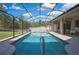 Inviting screened-in pool with a spacious patio for outdoor dining and relaxation at 11336 Flower Ave, Weeki Wachee, FL 34613