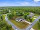Beautiful aerial perspective of a single-Gathering home surrounded by a wooded landscape at 12331 Fulmar Rd, Weeki Wachee, FL 34614
