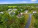 Scenic aerial view of a neighborhood with mature trees and green lawns at 12331 Fulmar Rd, Weeki Wachee, FL 34614