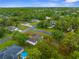 Expansive aerial shot of a residential area with homes nestled among dense trees at 12331 Fulmar Rd, Weeki Wachee, FL 34614
