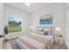 Bedroom featuring a bed, bedside tables, lamps, rug, and window with a view of the outdoors at 12331 Fulmar Rd, Weeki Wachee, FL 34614