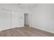 Bedroom featuring a double closet and light wood flooring at 12331 Fulmar Rd, Weeki Wachee, FL 34614