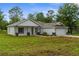 Charming single-Gathering home with a well-manicured lawn and inviting entrance at 12331 Fulmar Rd, Weeki Wachee, FL 34614