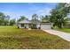 Beautifully landscaped front yard complements this delightful single-Gathering home at 12331 Fulmar Rd, Weeki Wachee, FL 34614