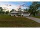 Well-maintained single-Gathering home with an attached garage and fresh landscaping at 12331 Fulmar Rd, Weeki Wachee, FL 34614