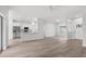 Open-concept living room featuring a modern kitchen and a light, neutral color palette at 12331 Fulmar Rd, Weeki Wachee, FL 34614