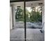 Patio view with sliding glass doors and a view of the backyard landscape at 12331 Fulmar Rd, Weeki Wachee, FL 34614