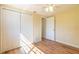 Bedroom with hardwood floors, closet, ceiling fan, and attached bathroom at 12709 Castleberry Ct, Hudson, FL 34667