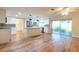 Open kitchen layout featuring stainless steel appliances, island, and light cabinetry at 12709 Castleberry Ct, Hudson, FL 34667