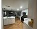 Modern kitchen with white cabinets, stone countertops, a kitchen island, and stainless steel appliances at 12709 Castleberry Ct, Hudson, FL 34667