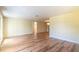 Bright and open living room with laminated floors and neutral paint tones at 12709 Castleberry Ct, Hudson, FL 34667