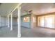 Open-air patio featuring ceiling fans, offering a versatile space for relaxation and gatherings with natural light at 12709 Castleberry Ct, Hudson, FL 34667