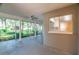 Screened patio featuring ceiling fan, columns and natural light at 12709 Castleberry Ct, Hudson, FL 34667