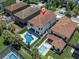 A backyard with a sparkling pool and lush landscaping providing an inviting retreat at 12889 Burns Dr, Odessa, FL 33556