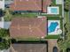 Aerial view showcasing pool and backyard with patio furniture and landscaping at 12889 Burns Dr, Odessa, FL 33556