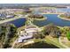 Extensive aerial view featuring multiple lakes, residential areas, community amenities, and winding roads at 12889 Burns Dr, Odessa, FL 33556