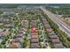 A sprawling suburban community is captured from above, revealing well-spaced homes near a highway at 12889 Burns Dr, Odessa, FL 33556