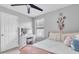 Cozy bedroom with a vanity desk and pink accents at 12889 Burns Dr, Odessa, FL 33556