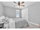 Neutral bedroom featuring carpet and ceiling fan near a closet at 12889 Burns Dr, Odessa, FL 33556