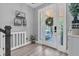 Inviting foyer with hardwood floors, bright lighting, and stylish decor at 12889 Burns Dr, Odessa, FL 33556