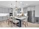 Modern kitchen featuring stainless steel appliances, a large island, and neutral color palette at 12889 Burns Dr, Odessa, FL 33556
