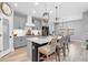 Beautiful kitchen with an island, pendant lighting, stainless appliances, and stylish barstools at 12889 Burns Dr, Odessa, FL 33556
