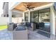 Outdoor patio features wood ceiling, ceiling fan, and comfortable seating at 12889 Burns Dr, Odessa, FL 33556
