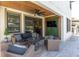 Relaxing outdoor patio area with wood ceiling, tv, and comfortable furniture at 12889 Burns Dr, Odessa, FL 33556
