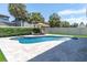 Private pool area with fountain, lounge chairs, and tropical landscaping at 12889 Burns Dr, Odessa, FL 33556
