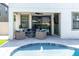 Private pool area features a fountain, outdoor seating, and lush landscaping at 12889 Burns Dr, Odessa, FL 33556