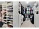 Organized walk-in closet with custom shelving and hanging space at 12889 Burns Dr, Odessa, FL 33556
