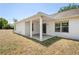Covered back porch with white beams, perfect for enjoying the backyard at 13098 Hanley Dr, Spring Hill, FL 34609