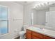 Bathroom featuring bright lighting, vanity with storage, and a convenient toilet layout at 13098 Hanley Dr, Spring Hill, FL 34609