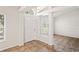 Bright foyer with tile flooring, white walls, and beam architectural details, leading into the home at 13098 Hanley Dr, Spring Hill, FL 34609