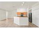 Open kitchen with granite counters, stainless appliances, and a breakfast bar overlooking the living area at 13098 Hanley Dr, Spring Hill, FL 34609