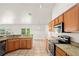Well-equipped kitchen featuring granite countertops, stainless steel appliances, and ample cabinet space at 13098 Hanley Dr, Spring Hill, FL 34609