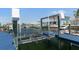 Close-up of a boat lift on a canal, highlighting its functionality for waterfront living at 13810 Celida Ave, Hudson, FL 34667