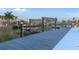 Waterfront property featuring a private boat dock and lift, providing direct access to the water at 13810 Celida Ave, Hudson, FL 34667